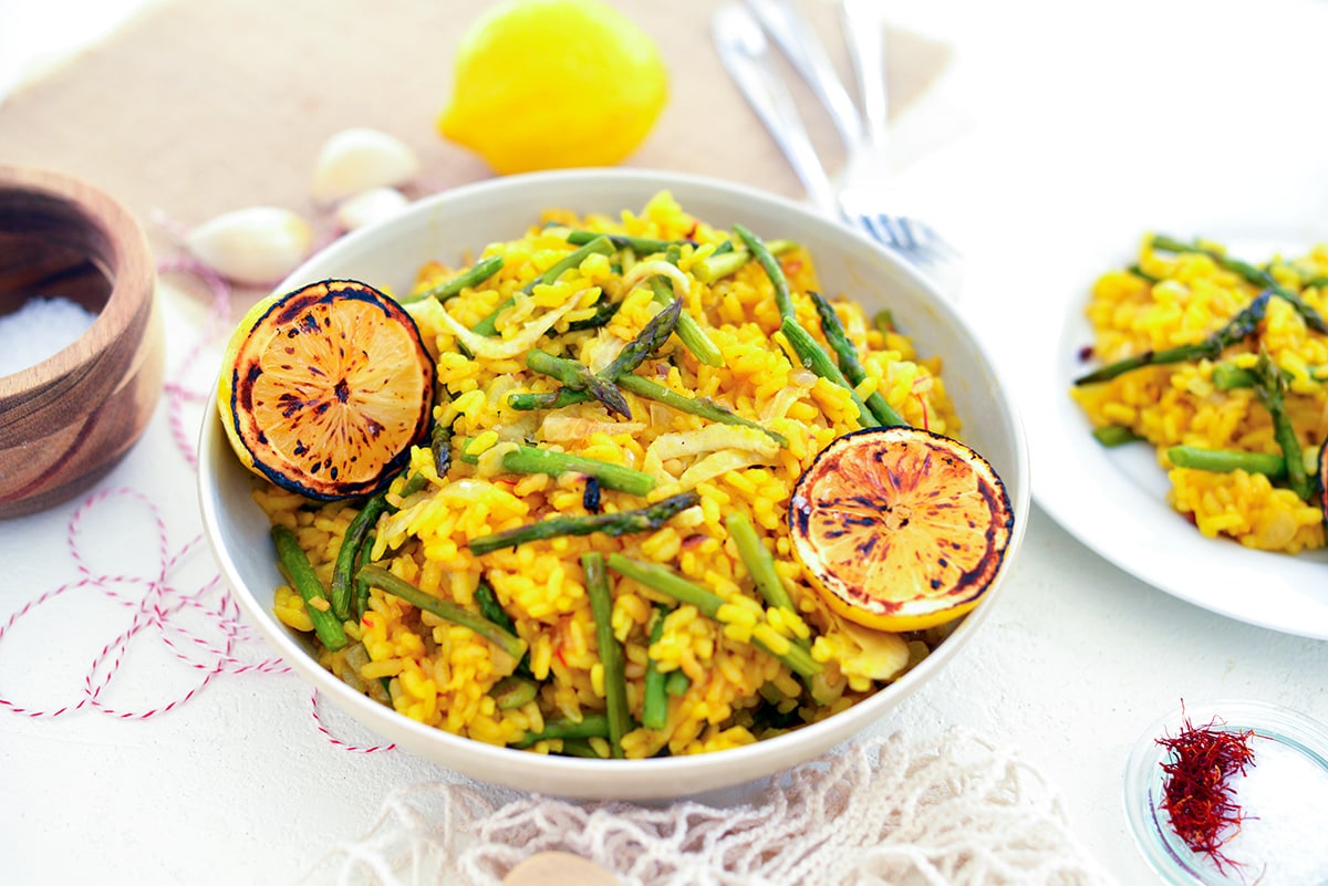 angled shot of bowl of lemon saffron risotto