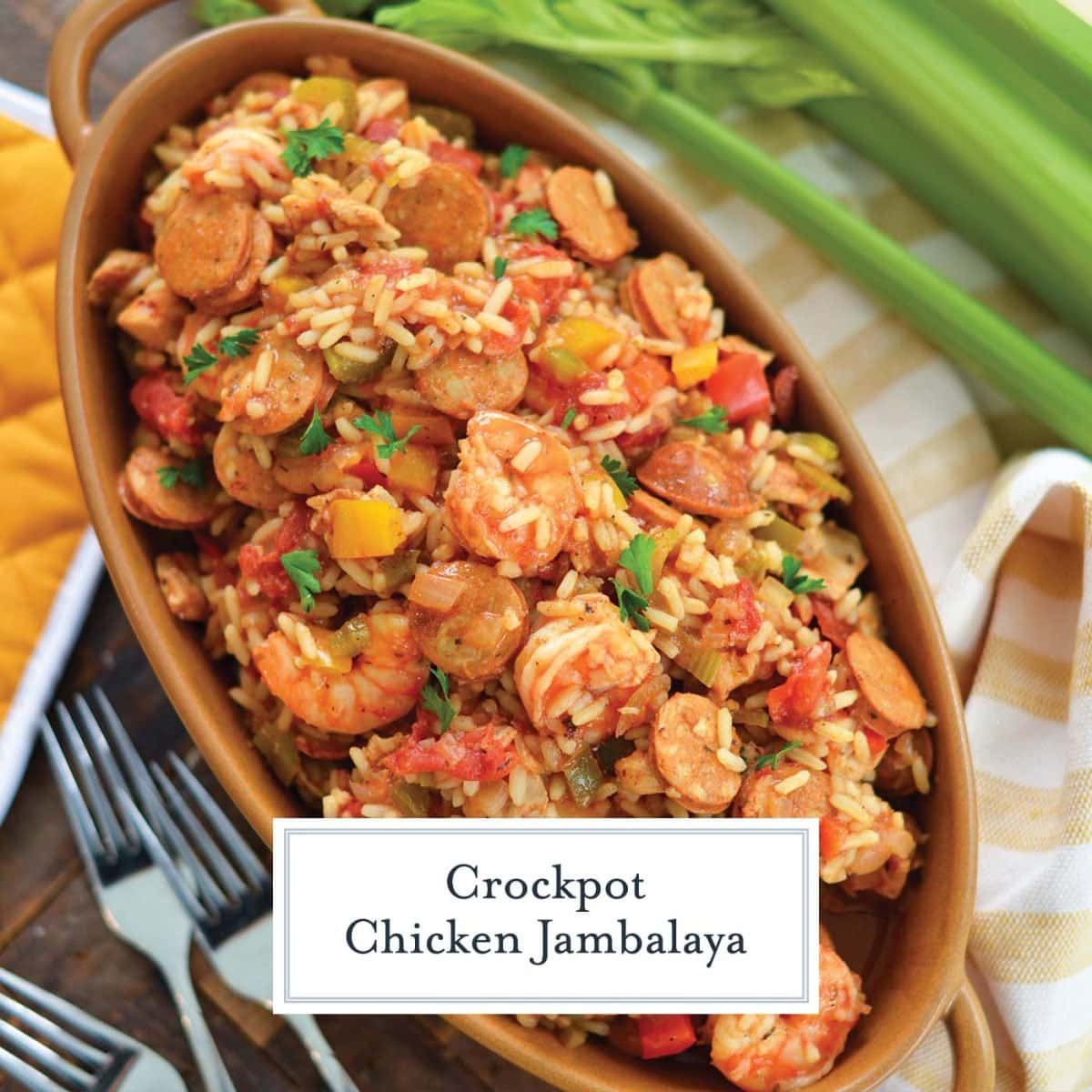 overhead of chicken jambalaya in a brown serving dish with fresh veggies
