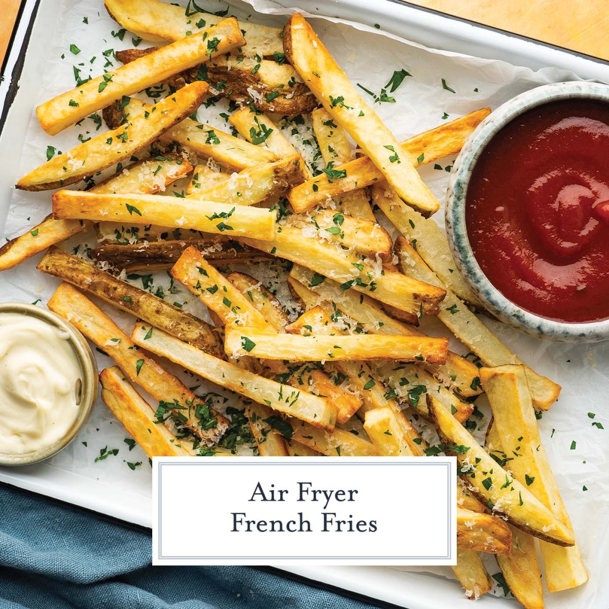 close up of french fried with cheese and parsley and ketchup