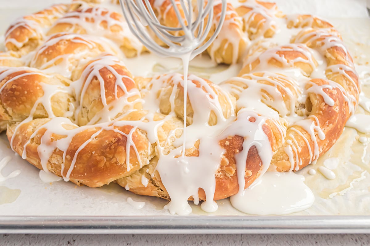 drizzling powdered sugar glaze onto a cake  