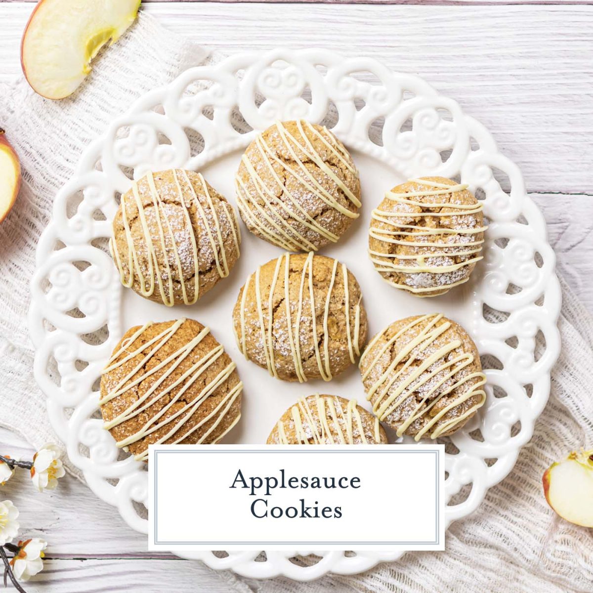 overhead of iced applesauce cookies on a white decorative plate