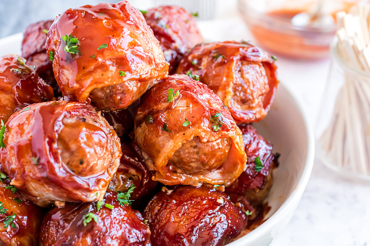 close up of bbq bacon wrapped meatballs 