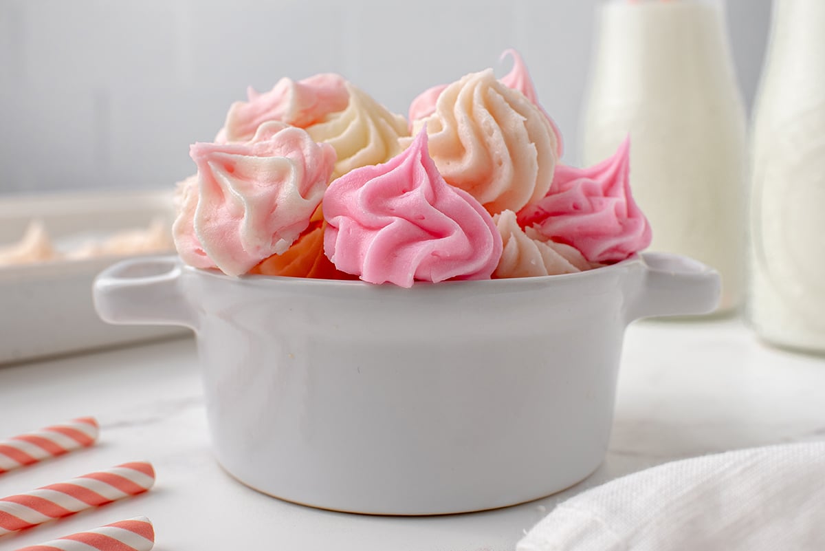 head-on view of rosette cream cheese candy in a white bowl 