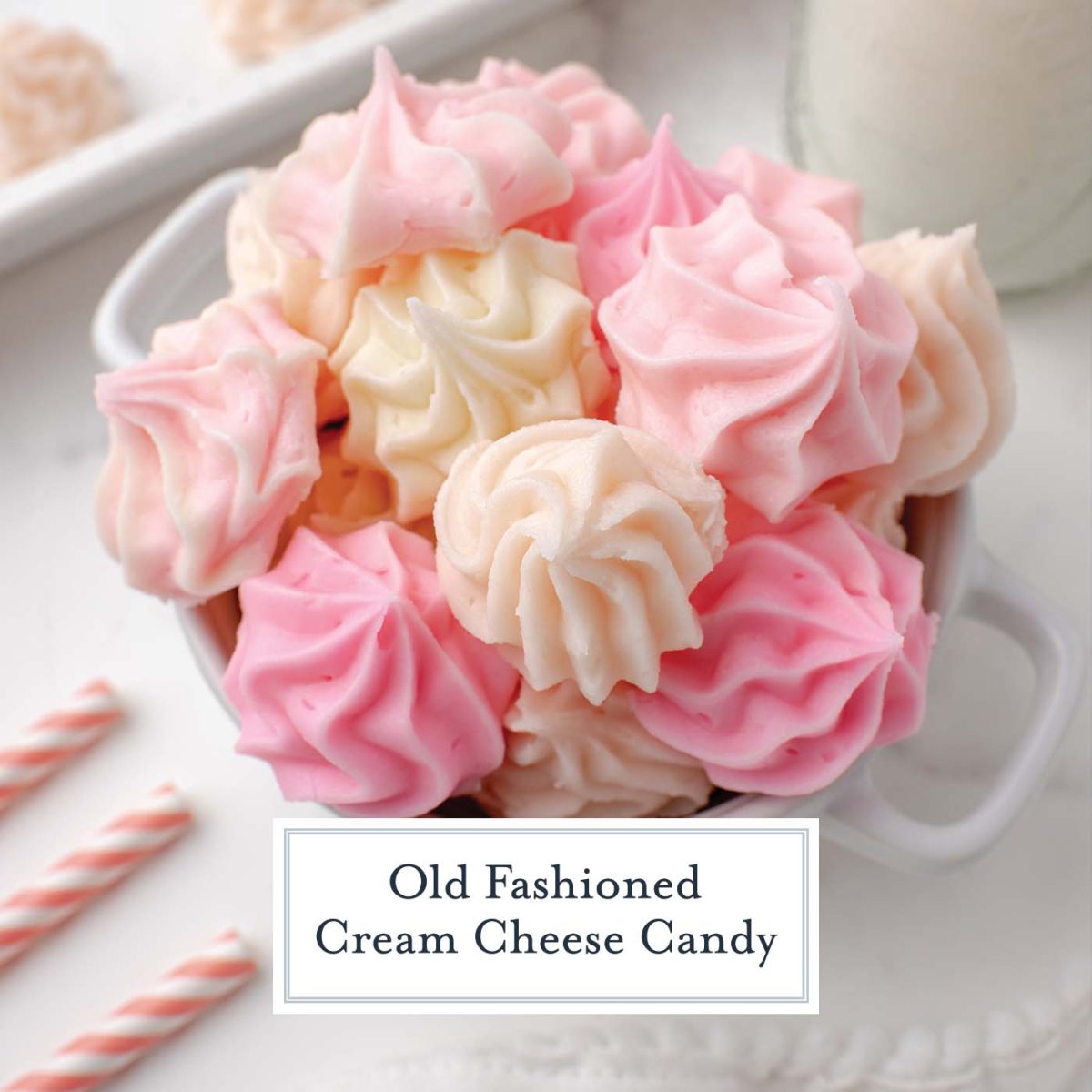 close up and angled cream cheese candy in shades of cream and pink 