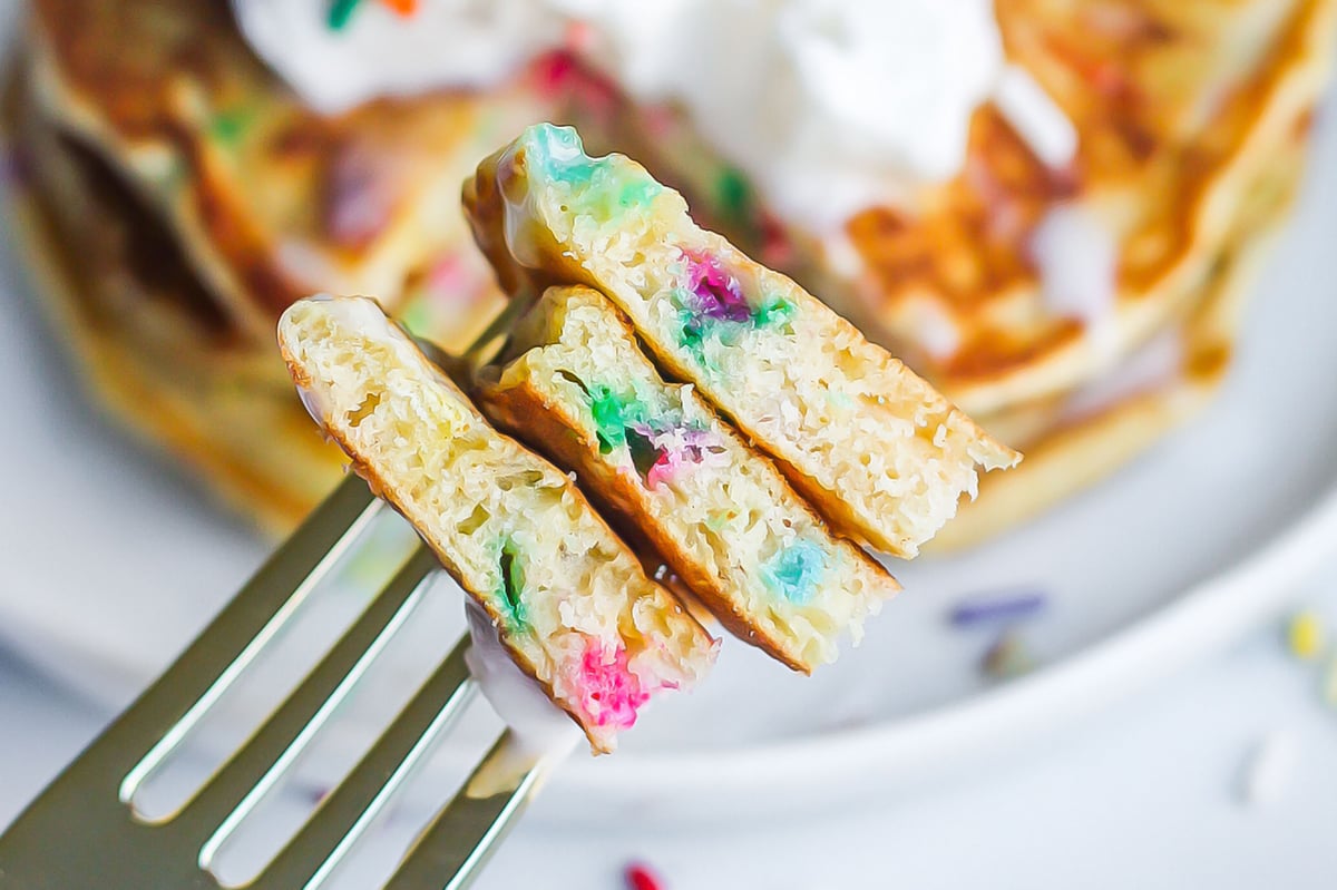 close up of funfetti pancakes on a fork 