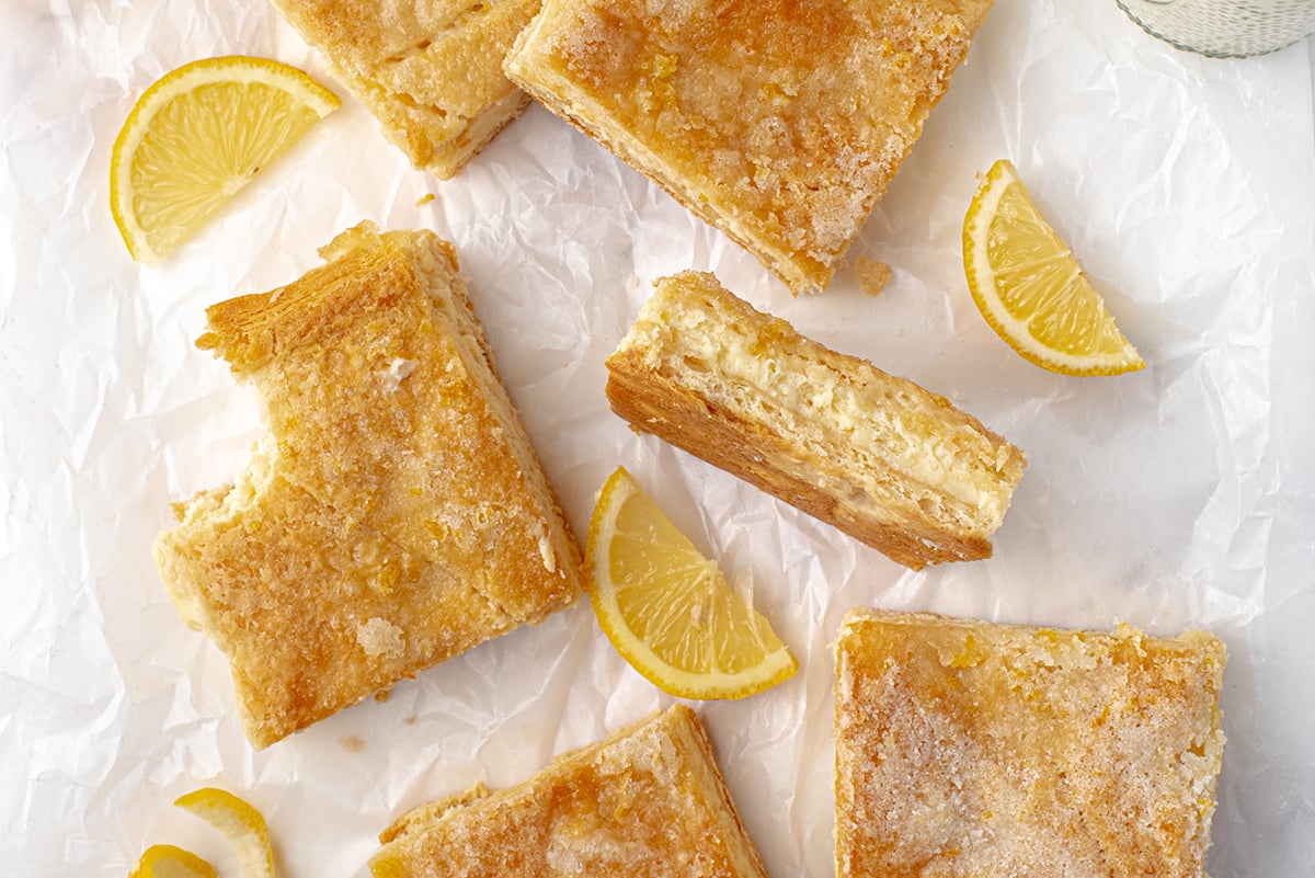 cheesecake bars on white crinkled paper 