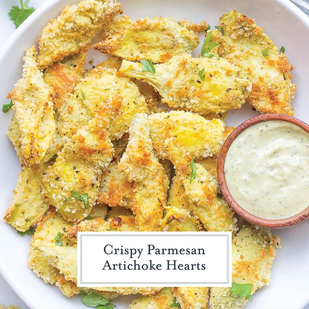 close up serving platter of breaded artichoke hearts 