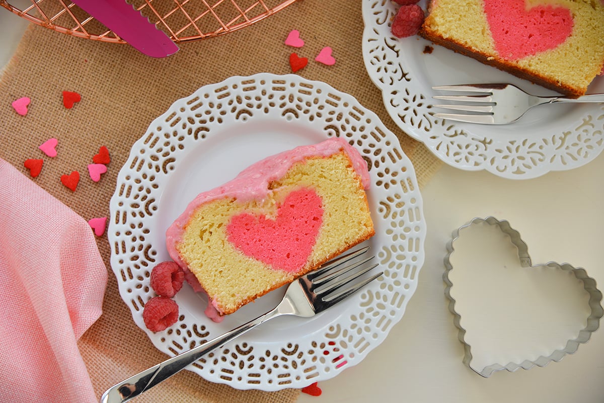 plates of cake with heart sprinkles and a cookie cutter