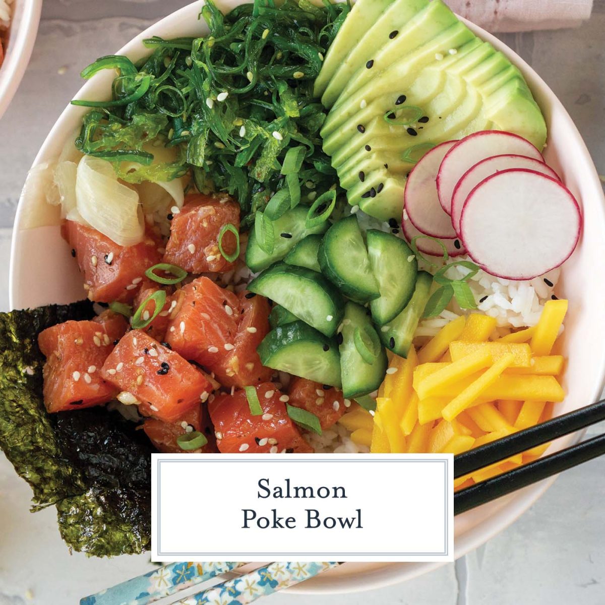 overhead bowl of salmon poke with chopsticks 