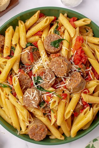 overhead of sausage pasta in a serving bowl