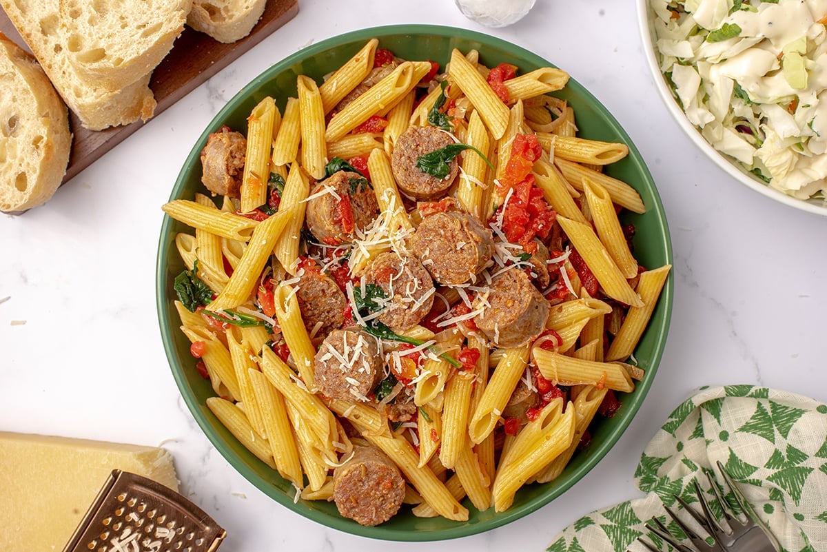 overhead of sausage pasta in a serving bowl