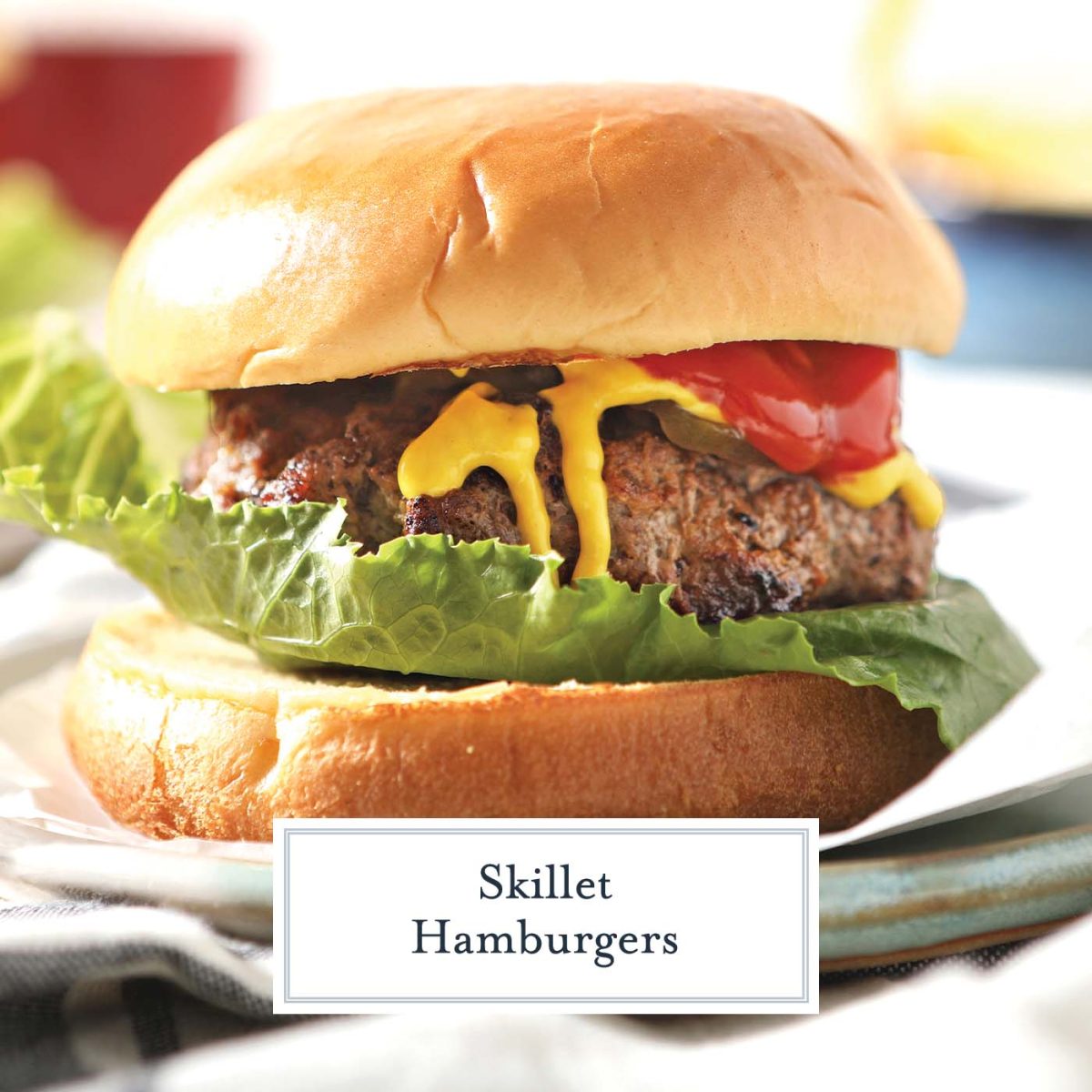 hand on close up of a dressed hamburger 