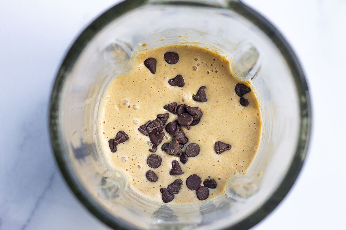 baked oats batter with chocolate chips in a blender 