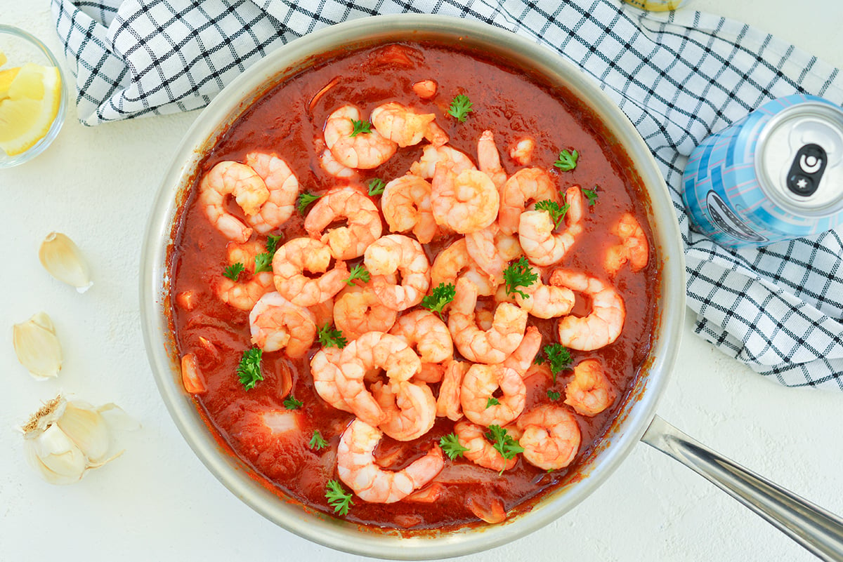 shrimp in a butter tomato sauce in a skillet 