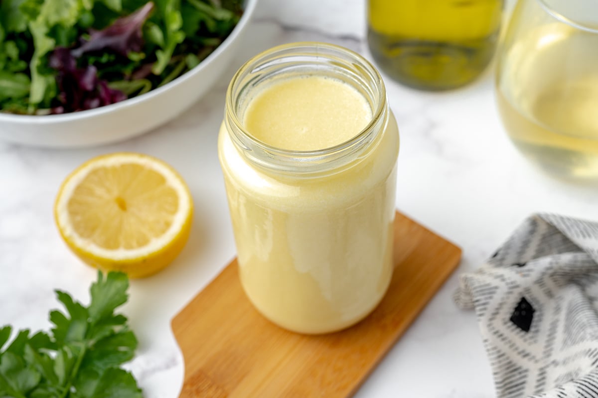 angle view of jar of white butter sauce 