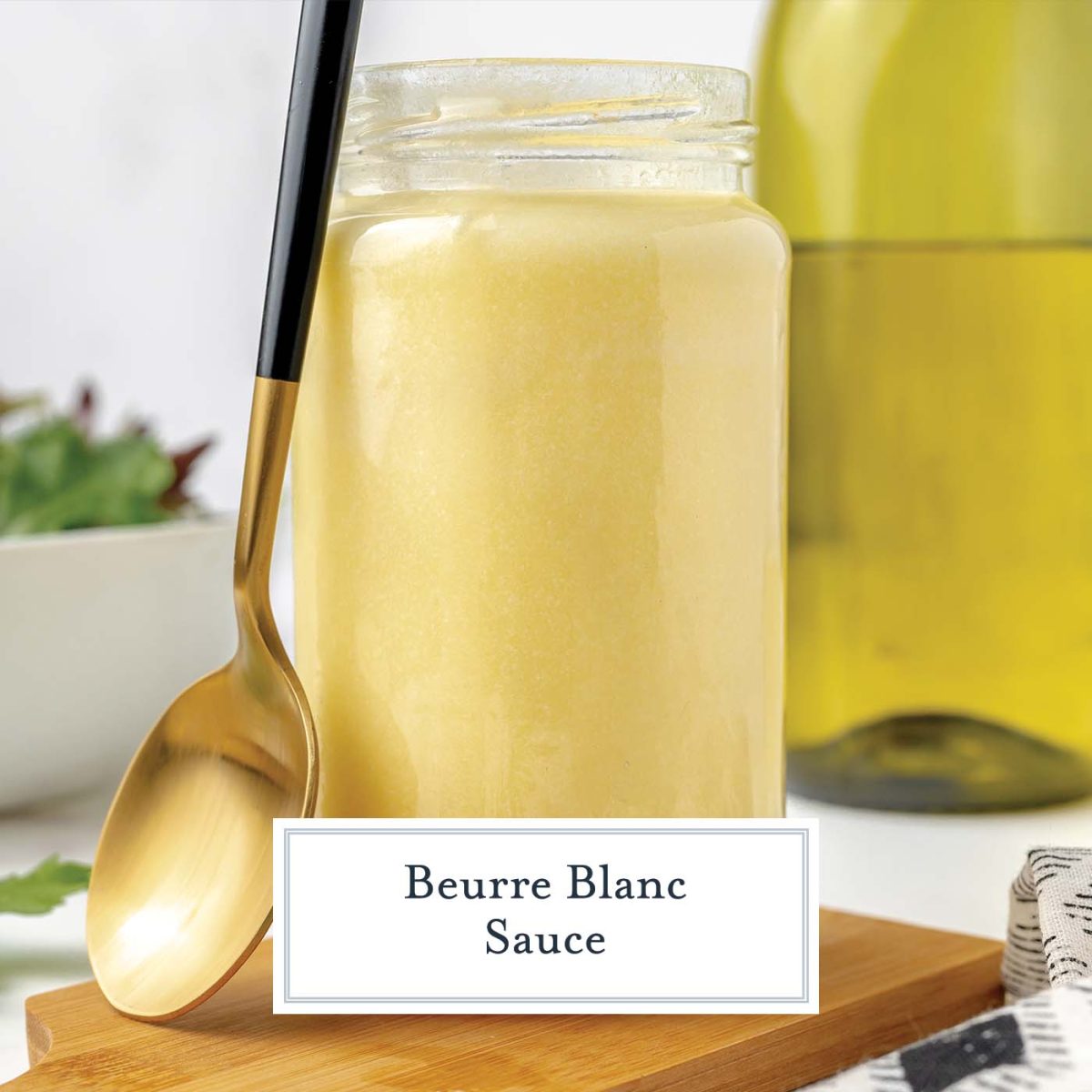 jar of beurre blanc sauce with a spoon resting on the side