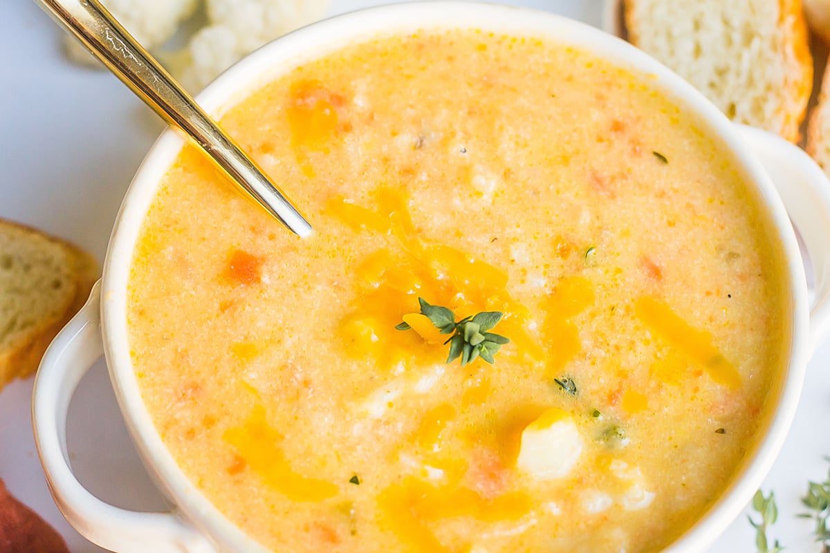 close up of cauliflower soup recipe with a spoon