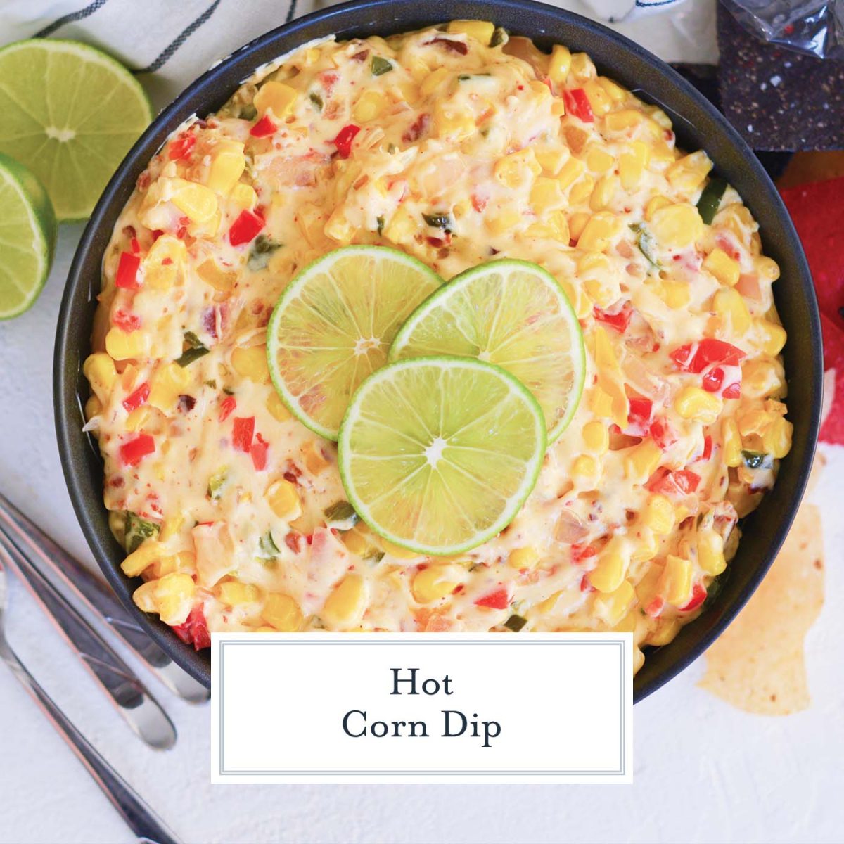 overhead of hot corn dip with lime slices
