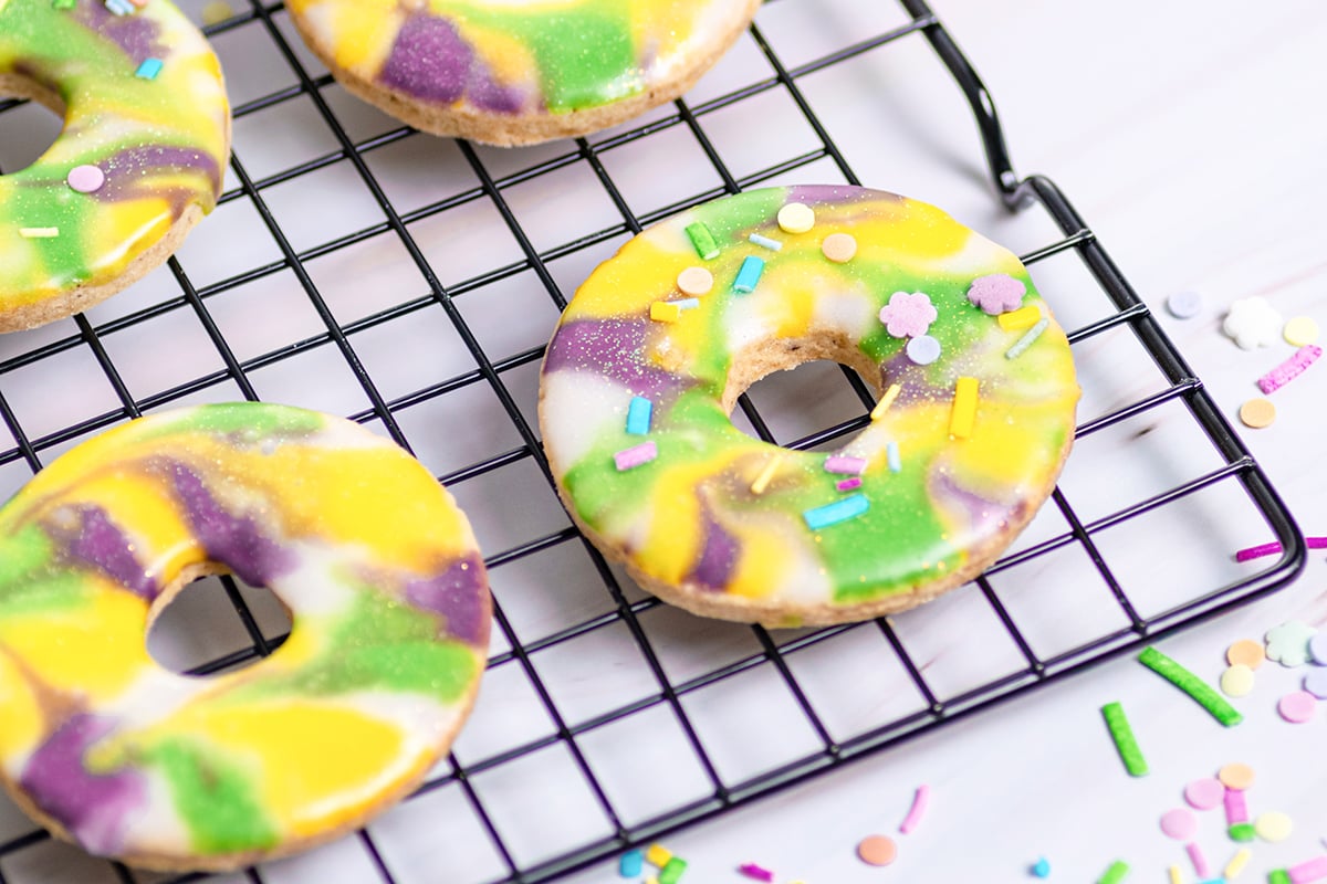close up of king cake cookies on a wire rack