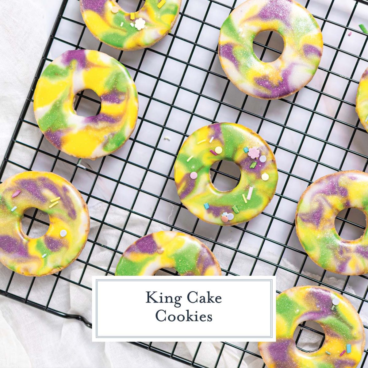 purple, yellow and green king cake cookies on a wire rack
