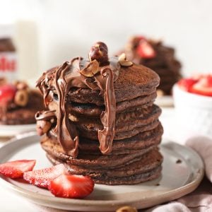 stack of nutella pancakes with strawberries