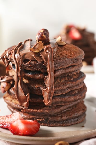 stack of nutella pancakes with strawberries