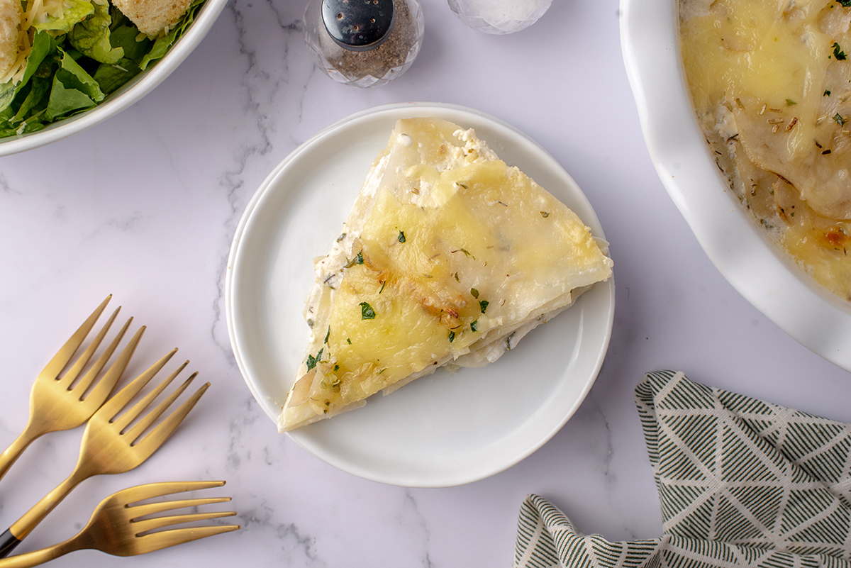 single slice of potato galette on a small white plate 