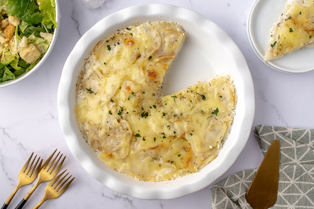 overhead of potato galette with a slice removed