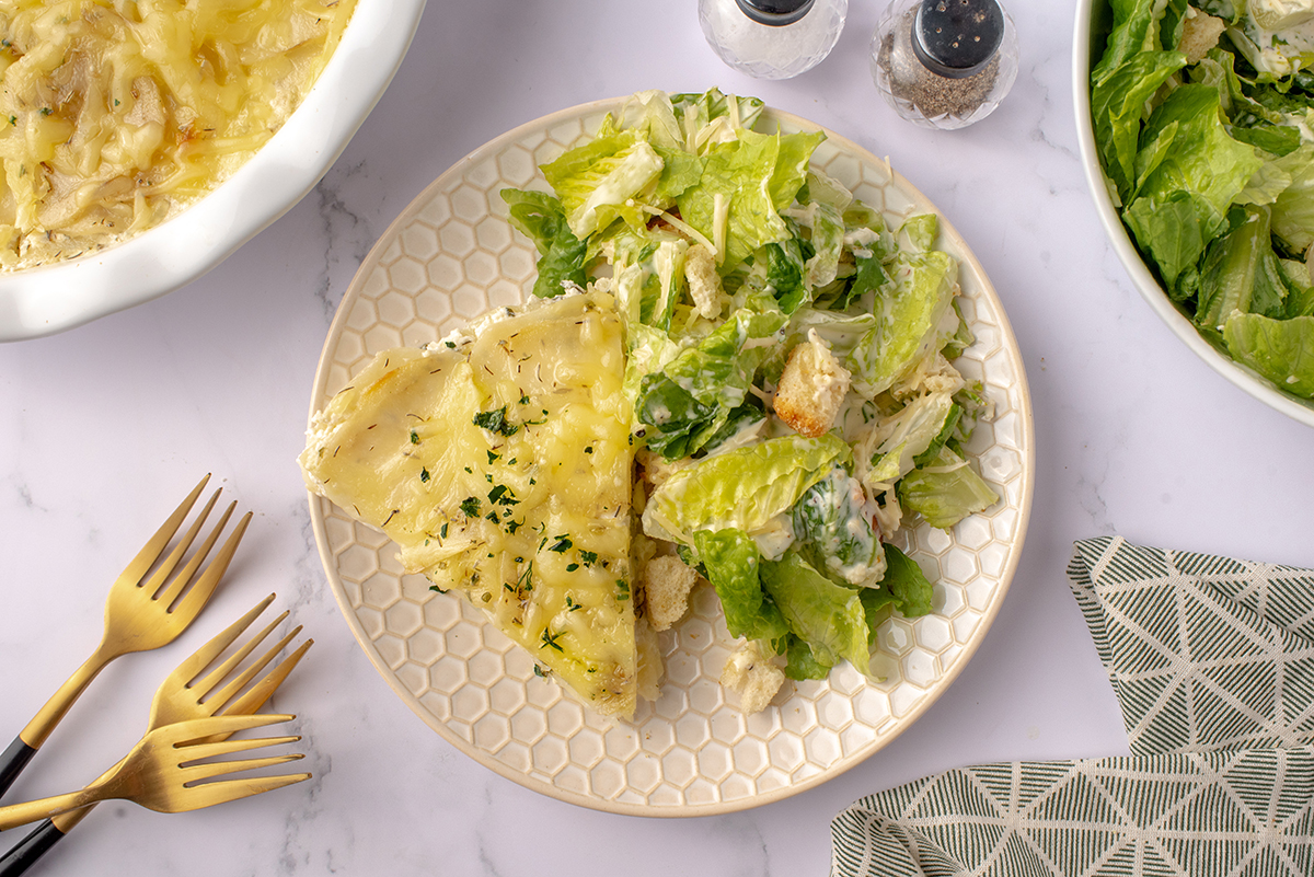 slice of potato pie on a honeycomb plate with salad