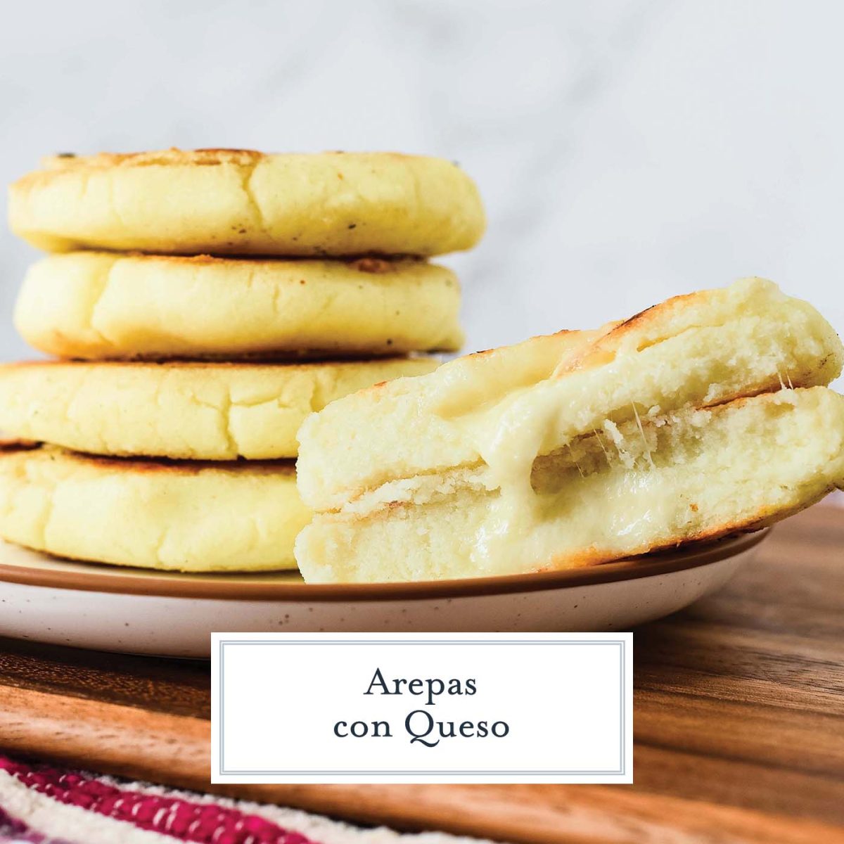 close up of arepas with one cut in half 