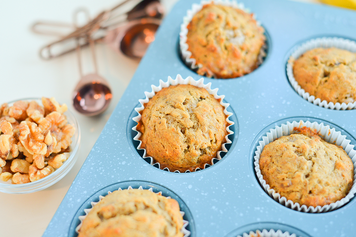 brown muffin tilted in a blue muffin tin 