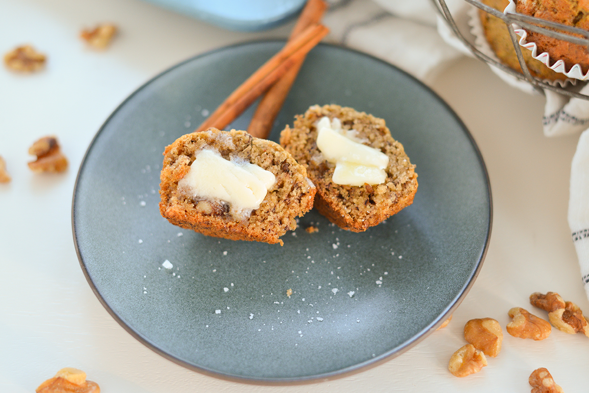 banana muffin cit in half with melty butter 