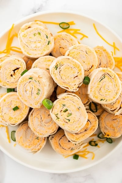 overhead of buffalo chicken pinwheels on a serving platter