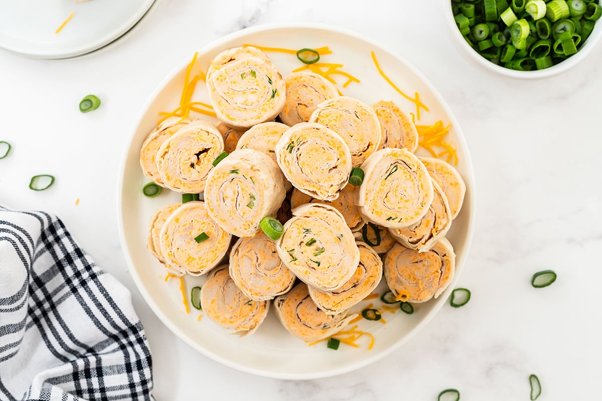 overhead of buffalo chicken pinwheels on a serving platter