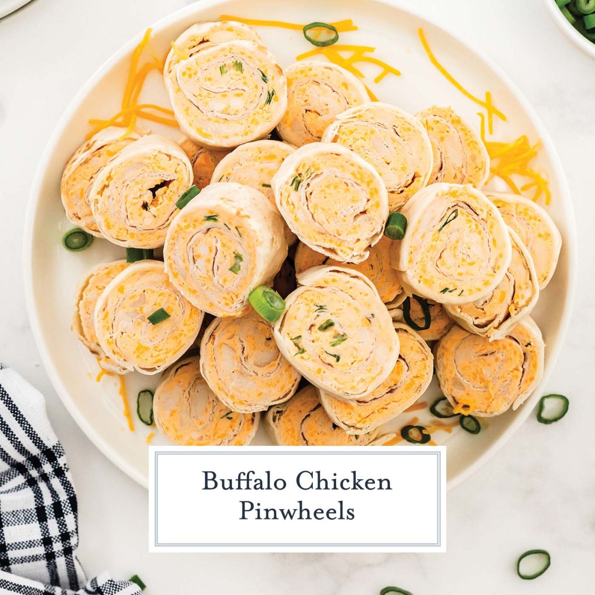 close up plate of buffalo chicken tortilla roll ups on a serving plate 