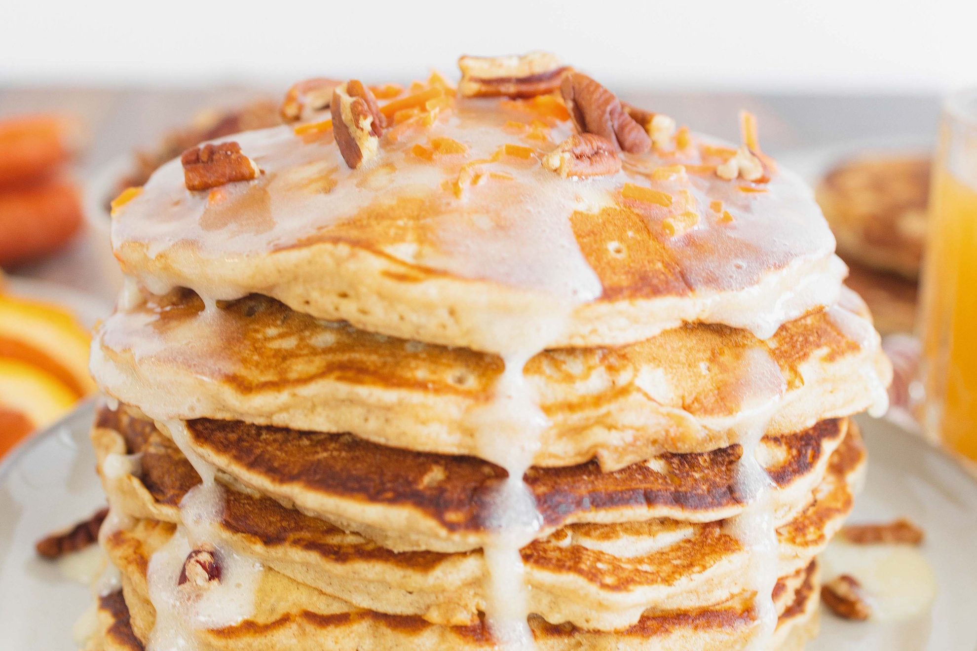 close up of carrot cake pancakes with blond syrup