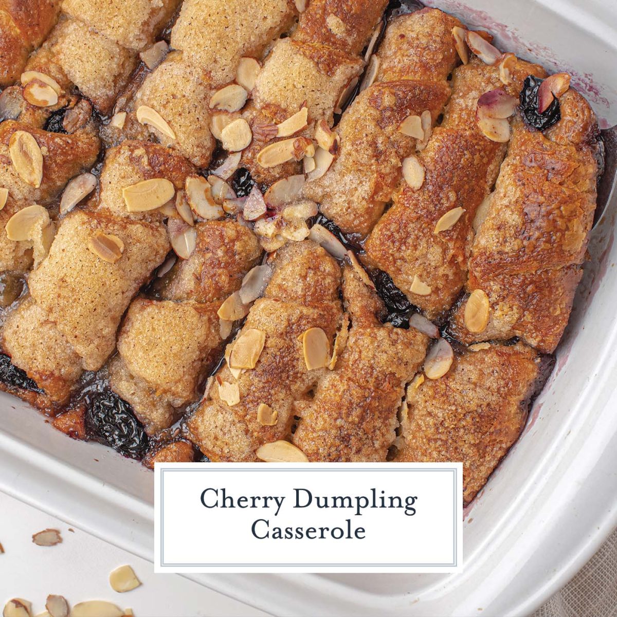 Close up overhead shot of cherry dumpling casserole in a white baking dish