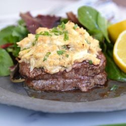 oscar style steak with lemon and side salad