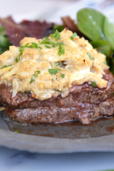 oscar style steak with lemon and side salad