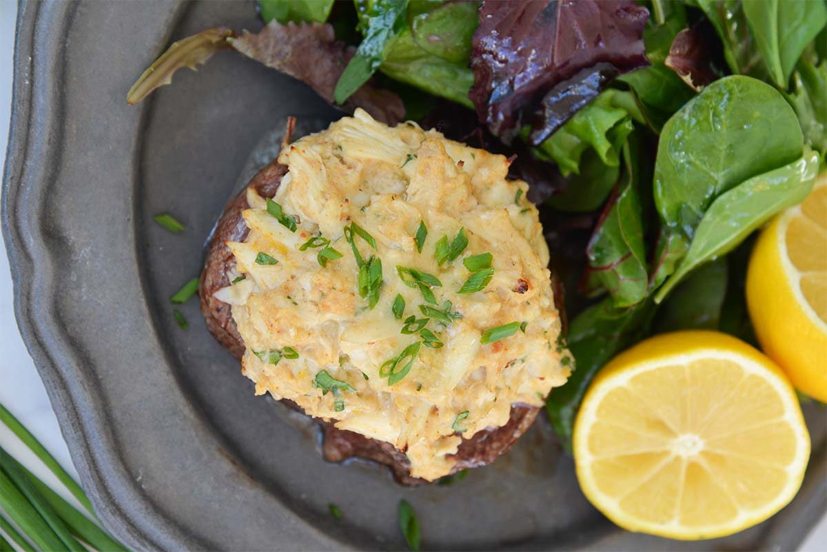 overhead of oscar style filet mignon with chives 