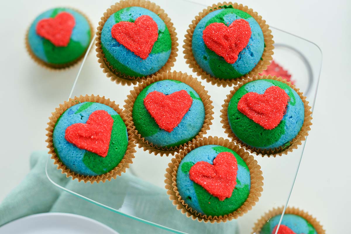 Earth Day cupcakes on a glass dessert tray 