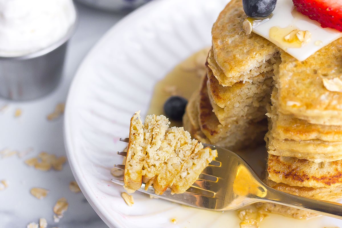 bite of pancakes on a gold fork 