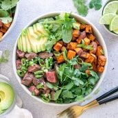 overhead of southwestern steak bowl with avocado