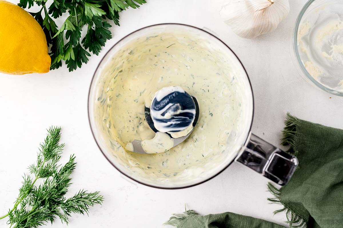 white aioli with fresh herbs sauce (fried green tomato dipping sauce) in a small food processor. 