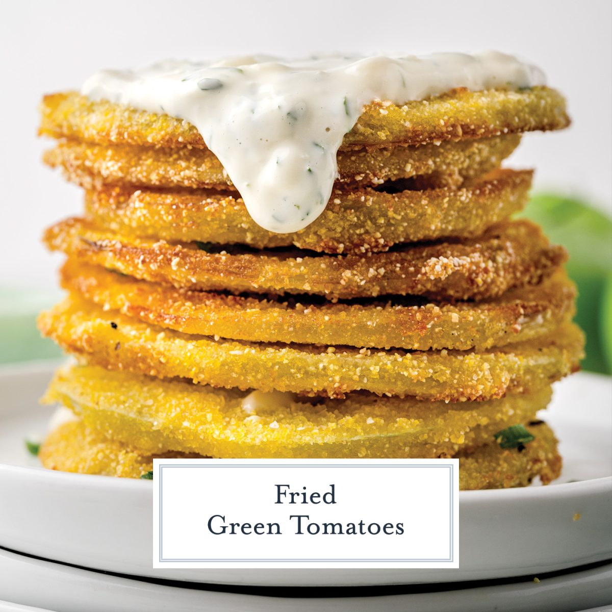 stack of fried green tomatoes with sauce dripping down the side