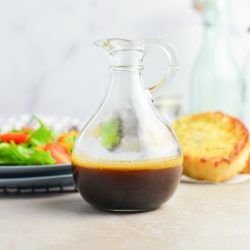 glass bottle of garlic balsamic vinaigrette