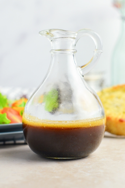 glass bottle of garlic balsamic vinaigrette