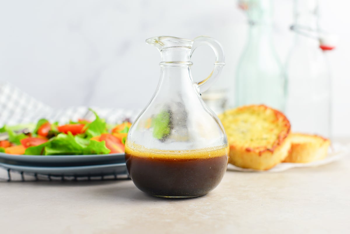 glass bottle of garlic balsamic vinaigrette