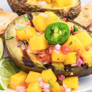 close up of grilled avocado stuffed with chicken