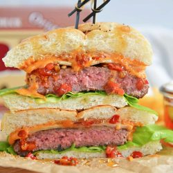 head on image of a sliced hot honey burger